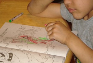 Tremendo is coloring spiderman red and green.